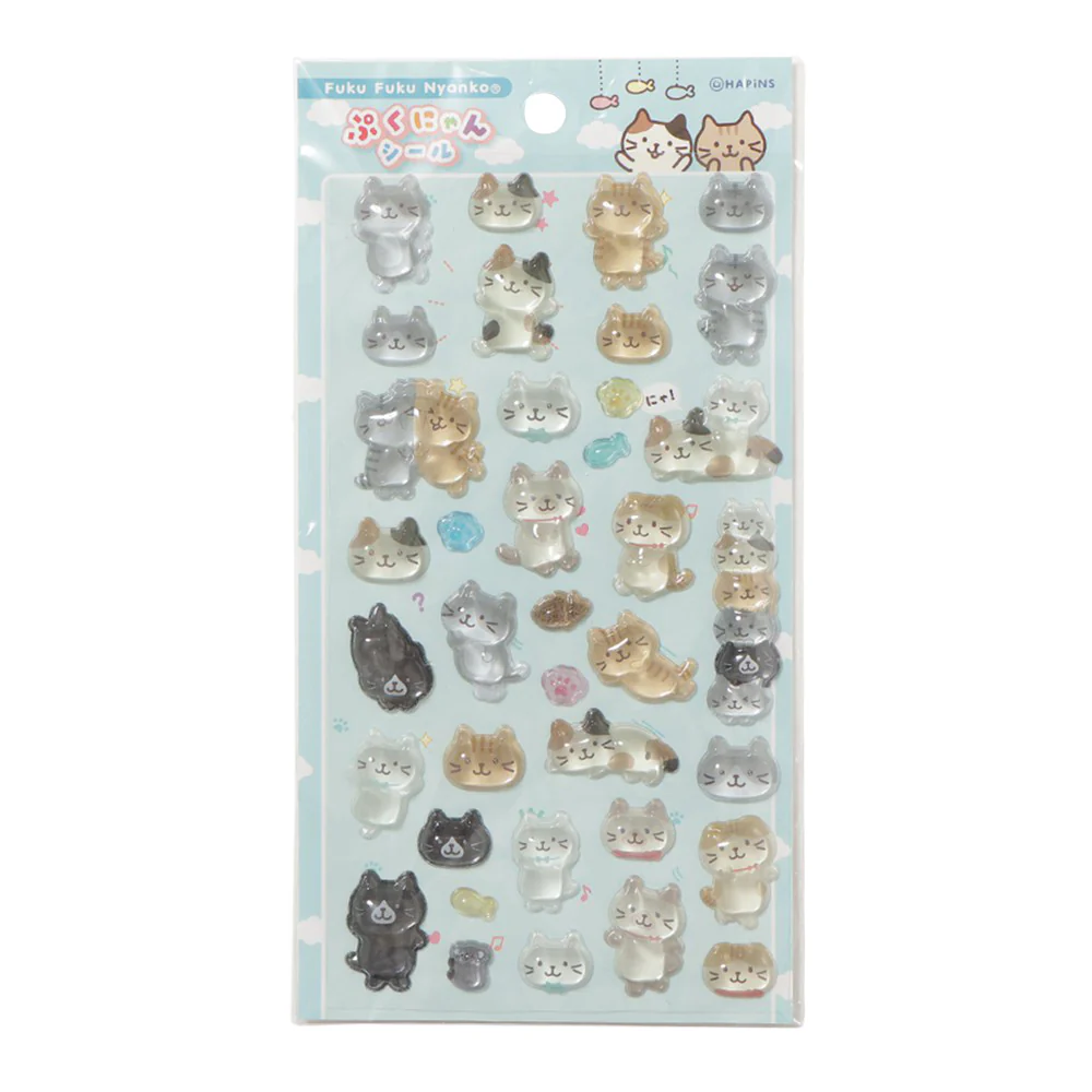 ふくふくにゃんこ ぷくにゃんシール ブルーの商品画像。水色の台紙に、ぷっくりとした立体感のある猫キャラクターシールが並んでいる。