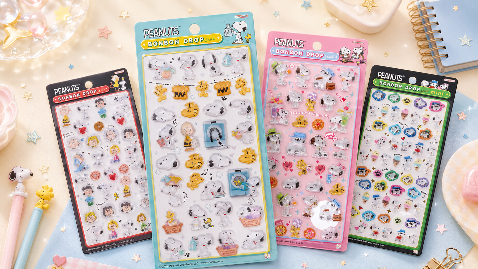 スヌーピーやウッドストックなどPEANUTSのボンボンドロップシールのパッケージを複数並べた、ぷっくりつやつや感が伝わる紹介画像